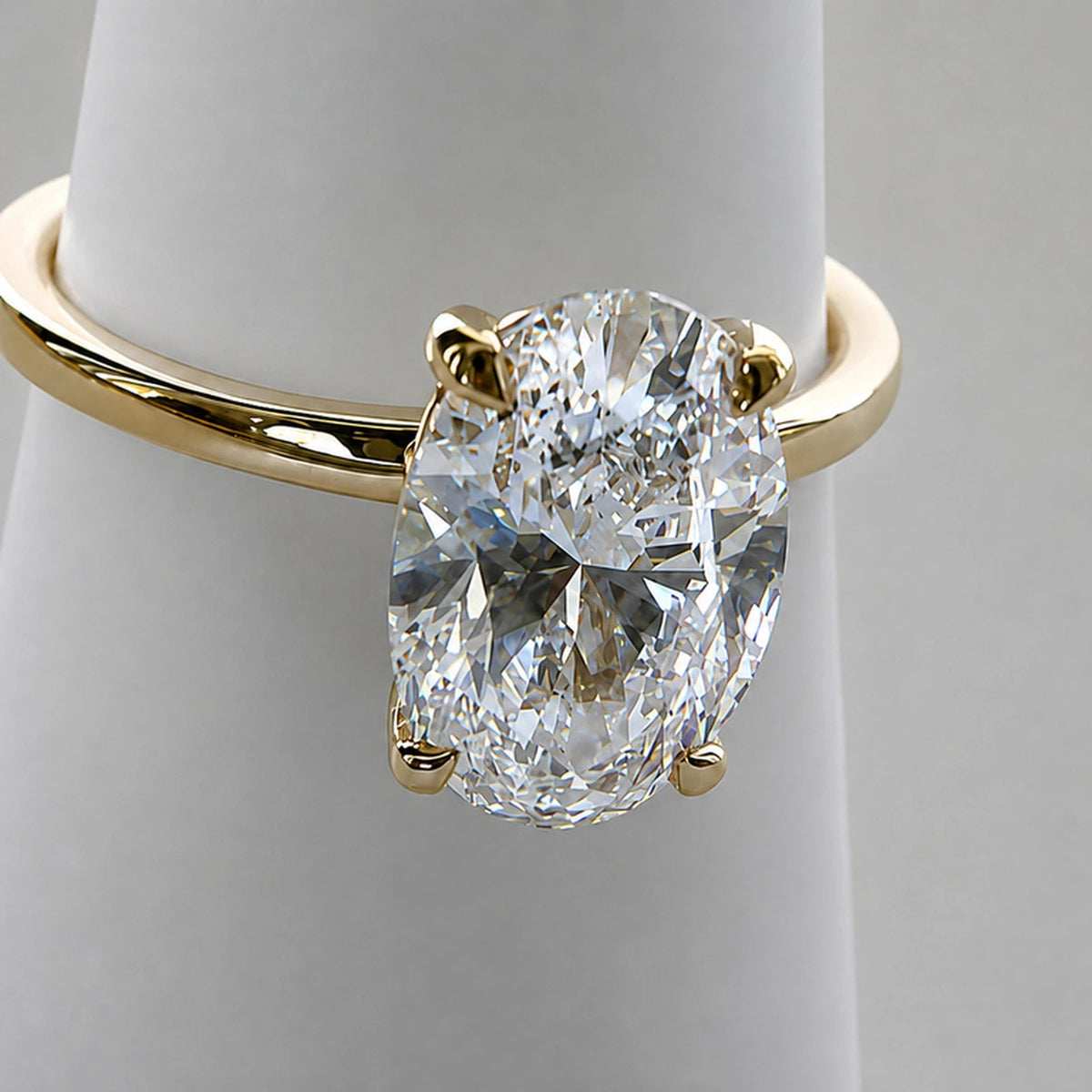 Three-quarter view of a 2.17ct oval diamond solitaire in 9ct yellow gold