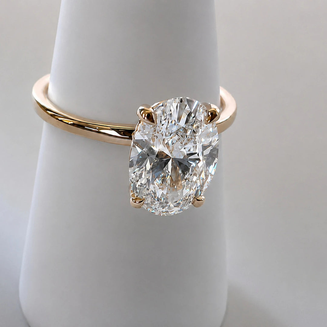 Close view of the four-claw setting on a 2.17ct oval diamond solitaire