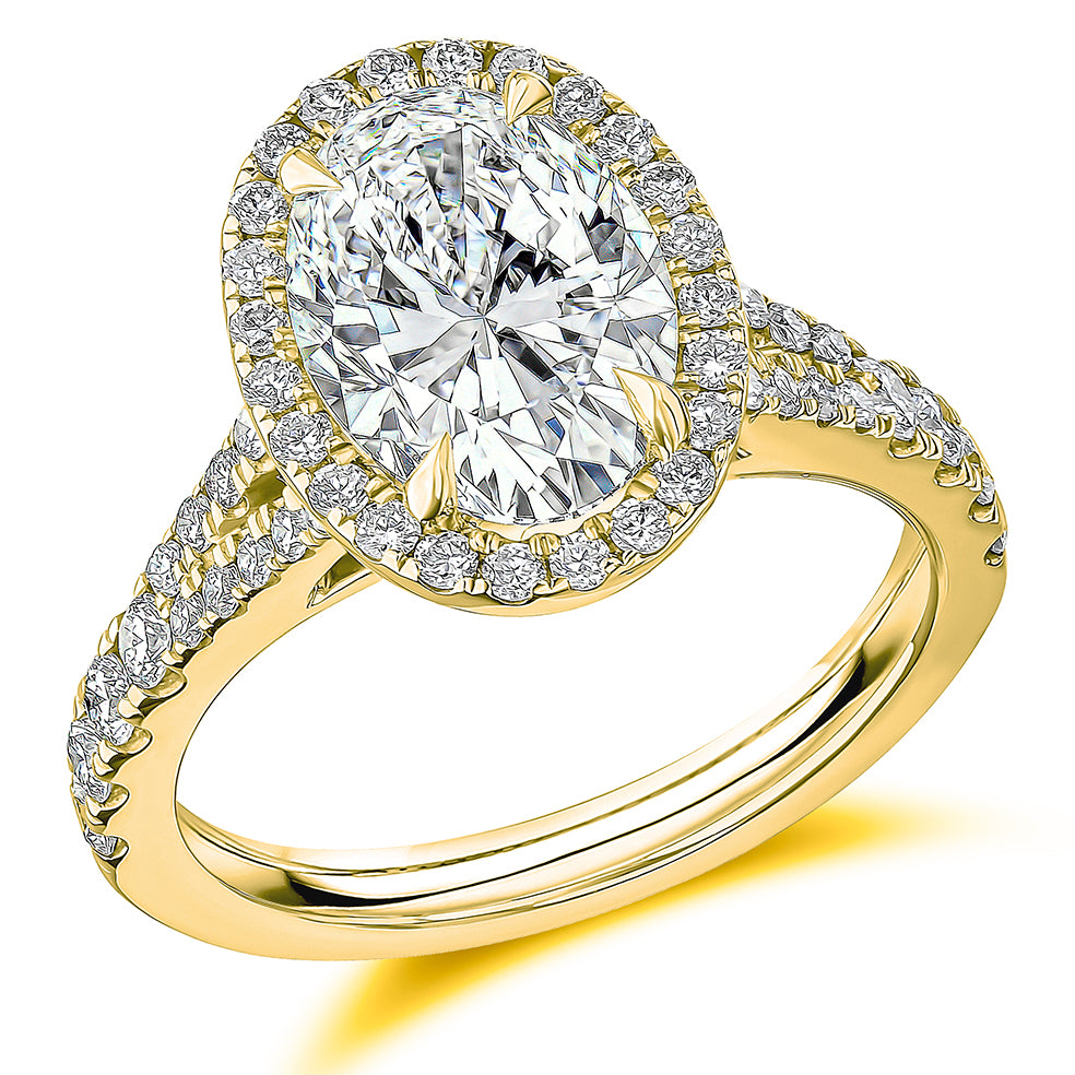 Curved-Shoulder Halo Oval Cut Engagement Ring in Yellow Gold