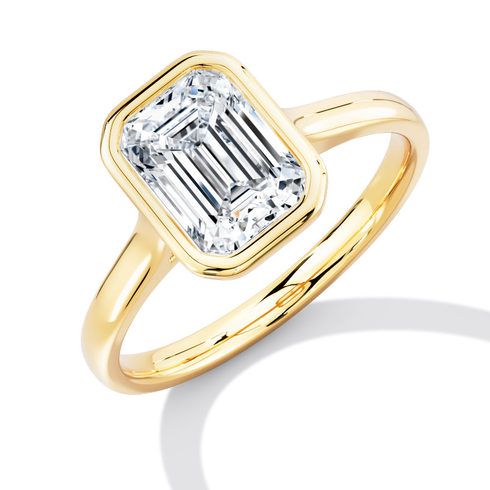 Bezel Set, Solitaire with Plain Shoulders Emerald Cut Engagement Ring, 1.50ct in Yellow Gold