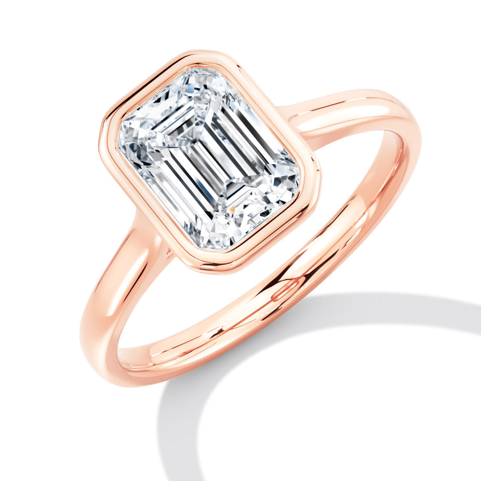 Bezel Set, Solitaire with Plain Shoulders Emerald Cut Engagement Ring, 1.50ct in Rose Gold
