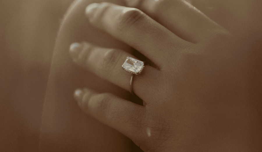 Hand wearing a For Your Eternity engagement ring
