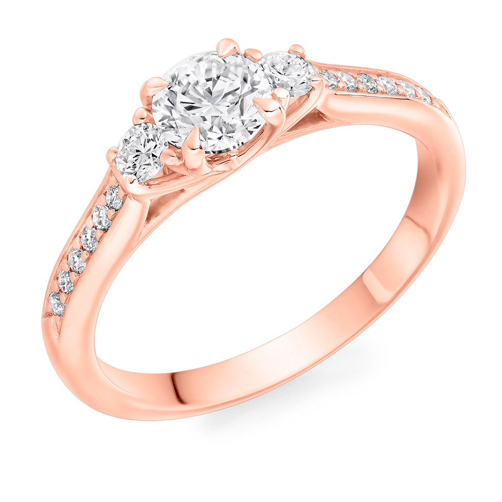 Diamond-Shouldered Trilogy Round Brilliant Trilogy Ring in Rose Gold