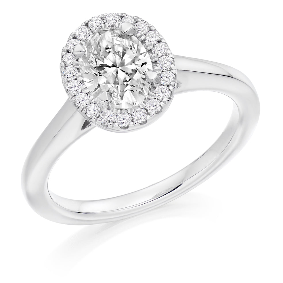 Clean-Shouldered Halo Oval Cut Engagement Ring in White Gold