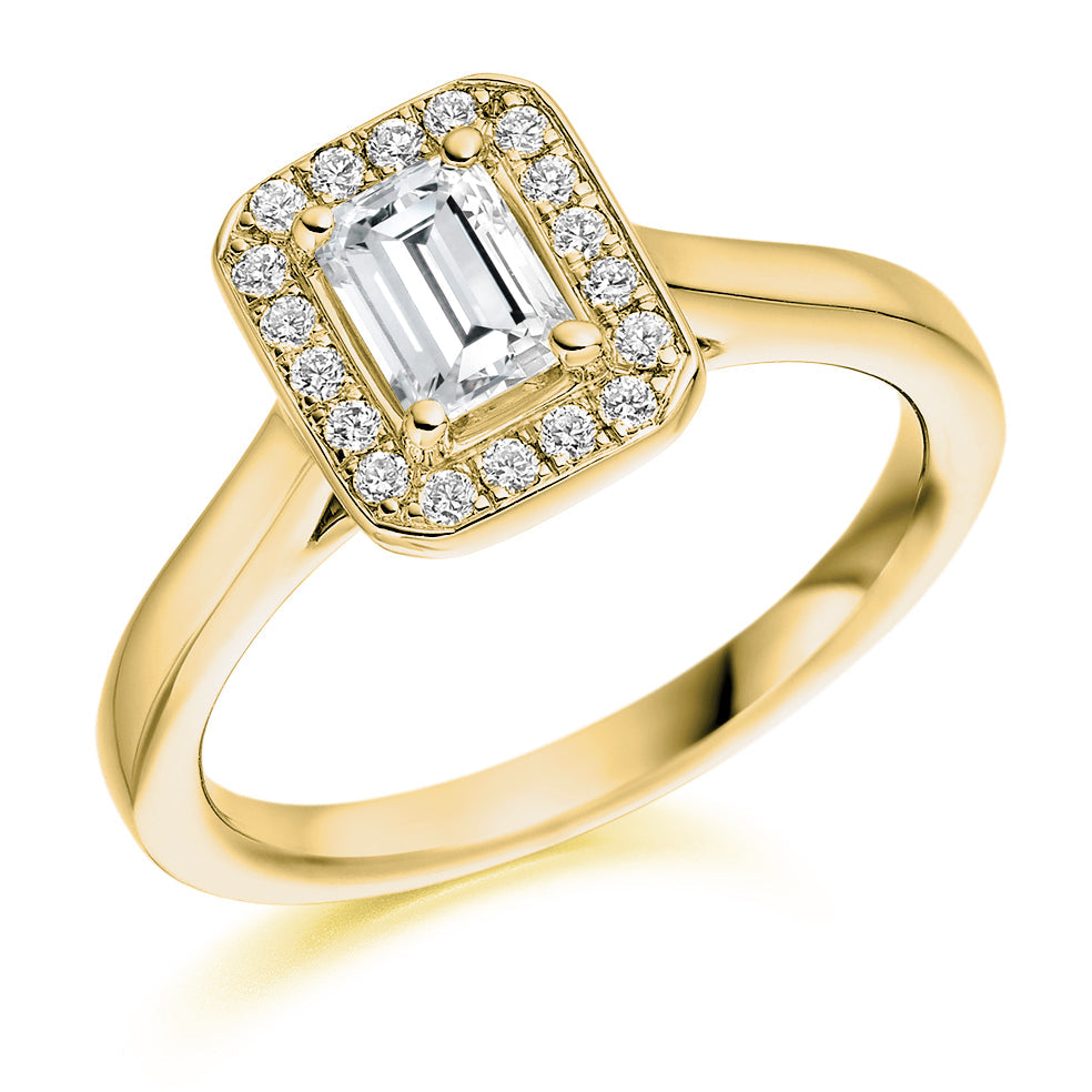 Quiet Halo Emerald Cut Engagement Ring in Yellow Gold
