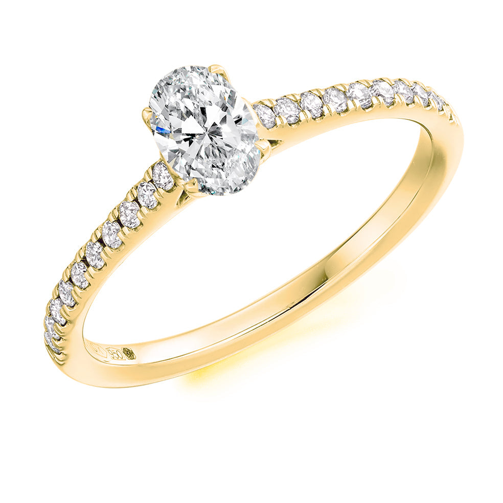 Diamond-Shouldered Solitaire Oval Cut Engagement Ring in Yellow Gold