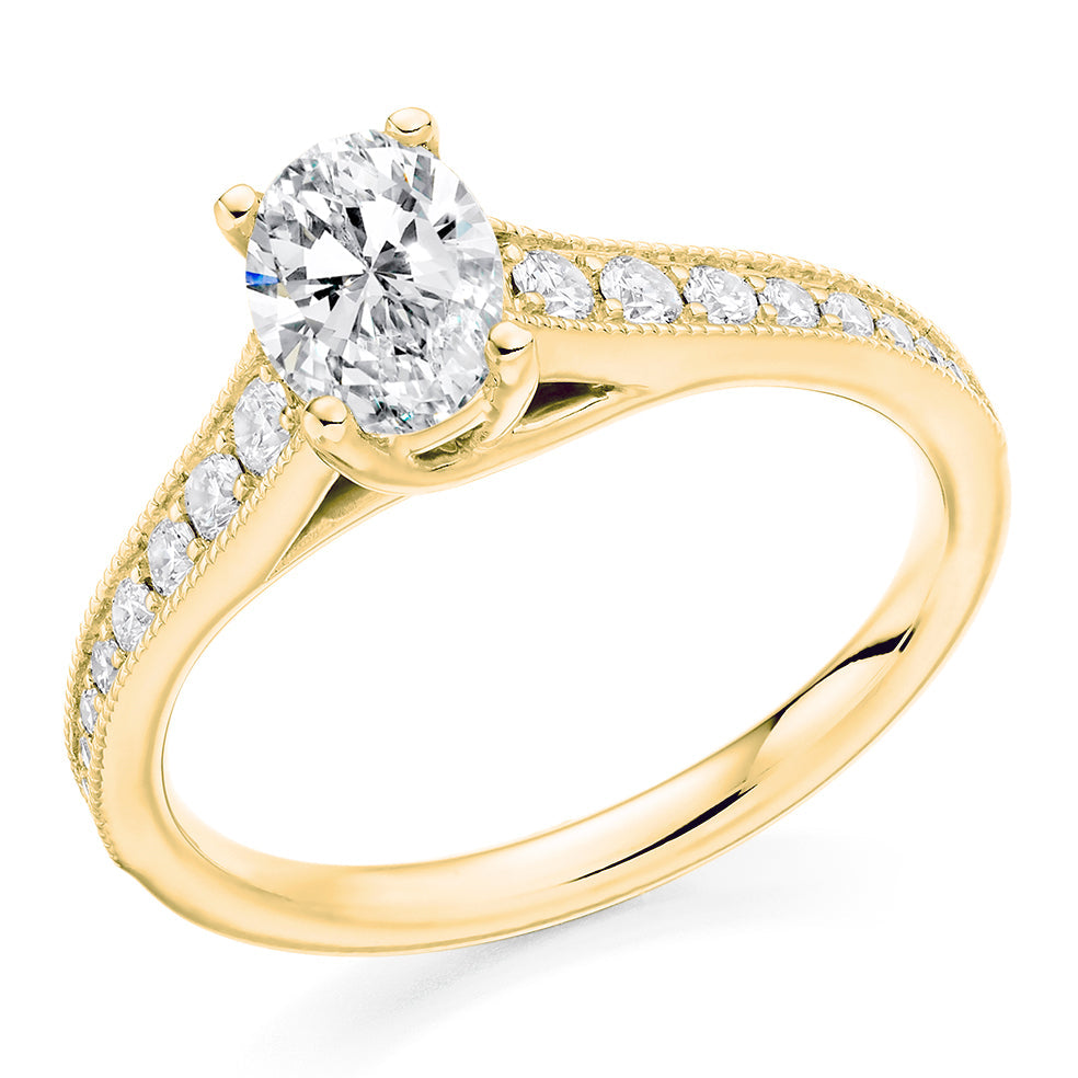 Pavé-Shouldered Solitaire Oval Cut Engagement Ring in Yellow Gold