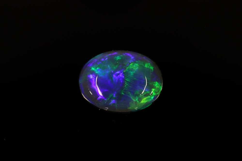 Oval Multi_color Opal 0.54ct loose gemstone