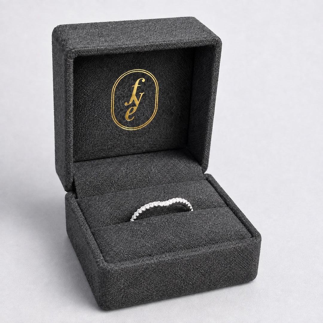 Curved diamond set platinum wedding ring in a For Your Eternity gift box