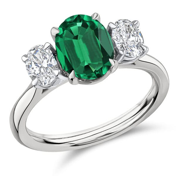 Emerald and Diamond Oval Cut Trilogy Engagement Ring