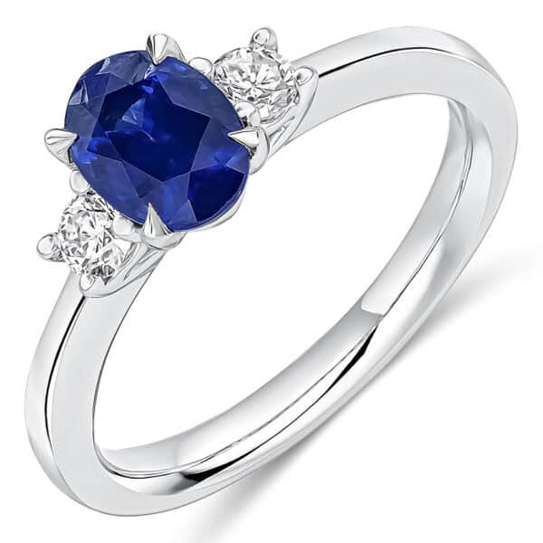 Blue Sapphire and Diamond Oval Cut Trilogy Engagement Ring