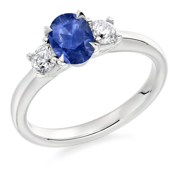 Blue Sapphire and Diamond Oval Cut Trilogy Engagement Ring